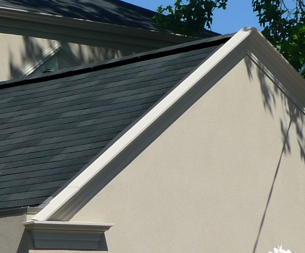 Outlet rigde ventilation in an asphalt shingle system